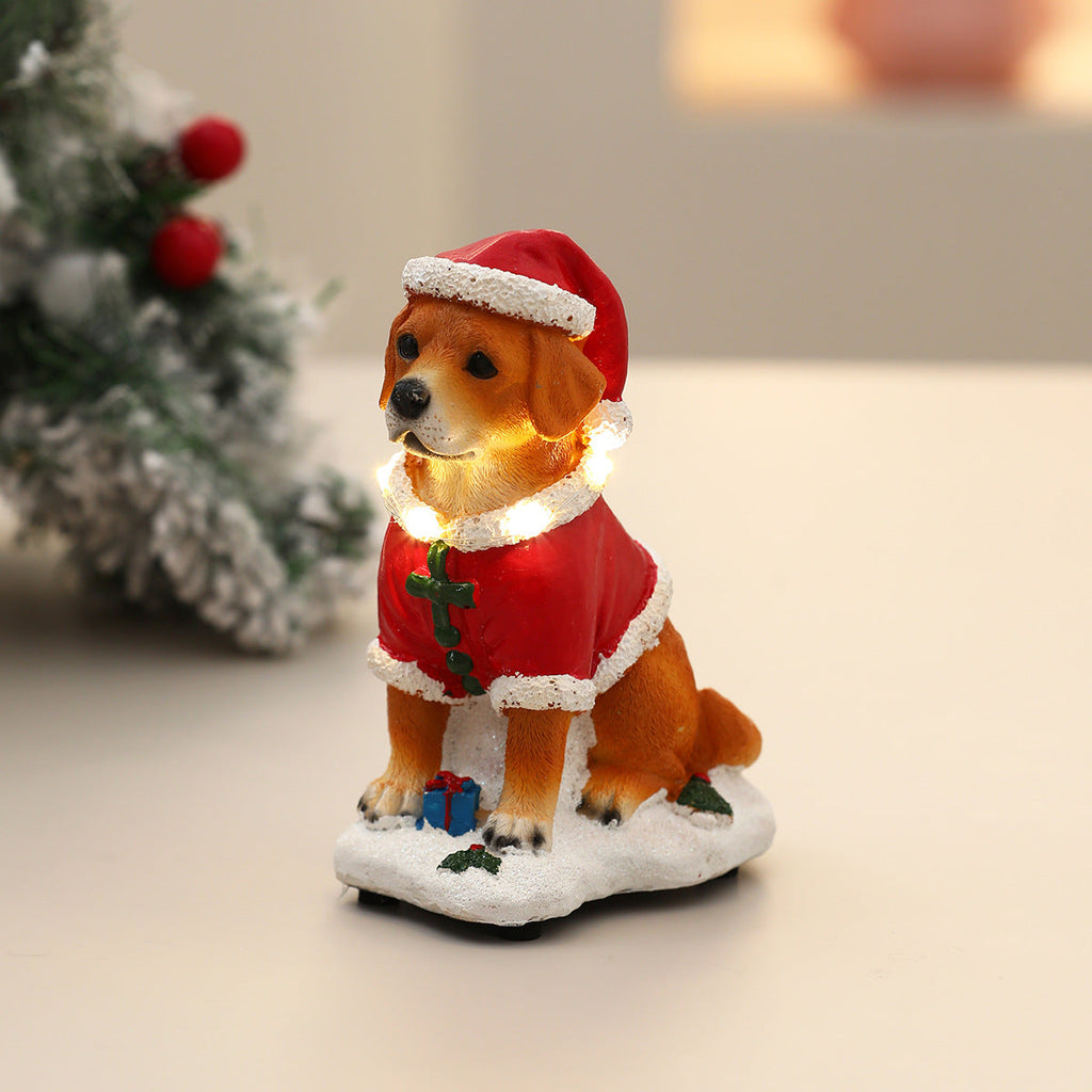 Close-up van het hondenbeeldje in kerstmanpak met LED-licht