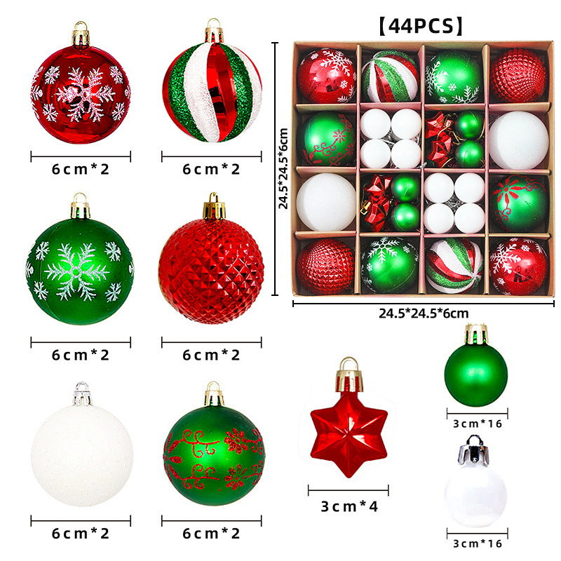 Rode, groene en witte kerstballen in een decoratieve set